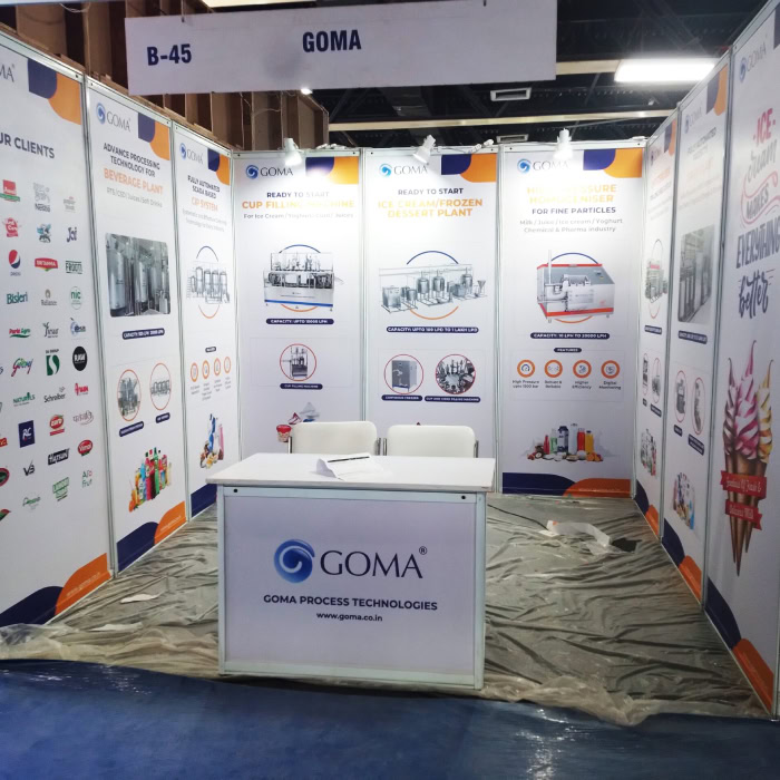 Shell scheme exhibition stand with printed product panels and a counter