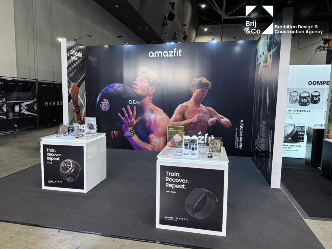 Amazfit exhibition stand with white plinths displaying smartwatches