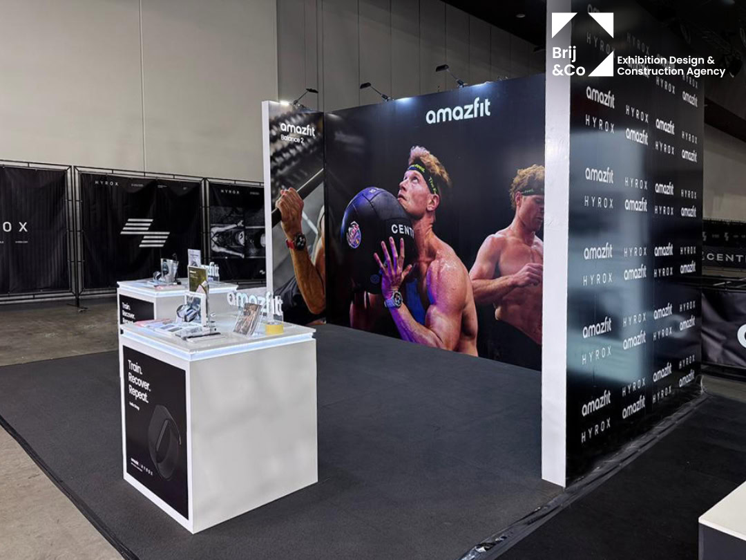 Amazfit exhibition stand with athlete graphics and product plinths