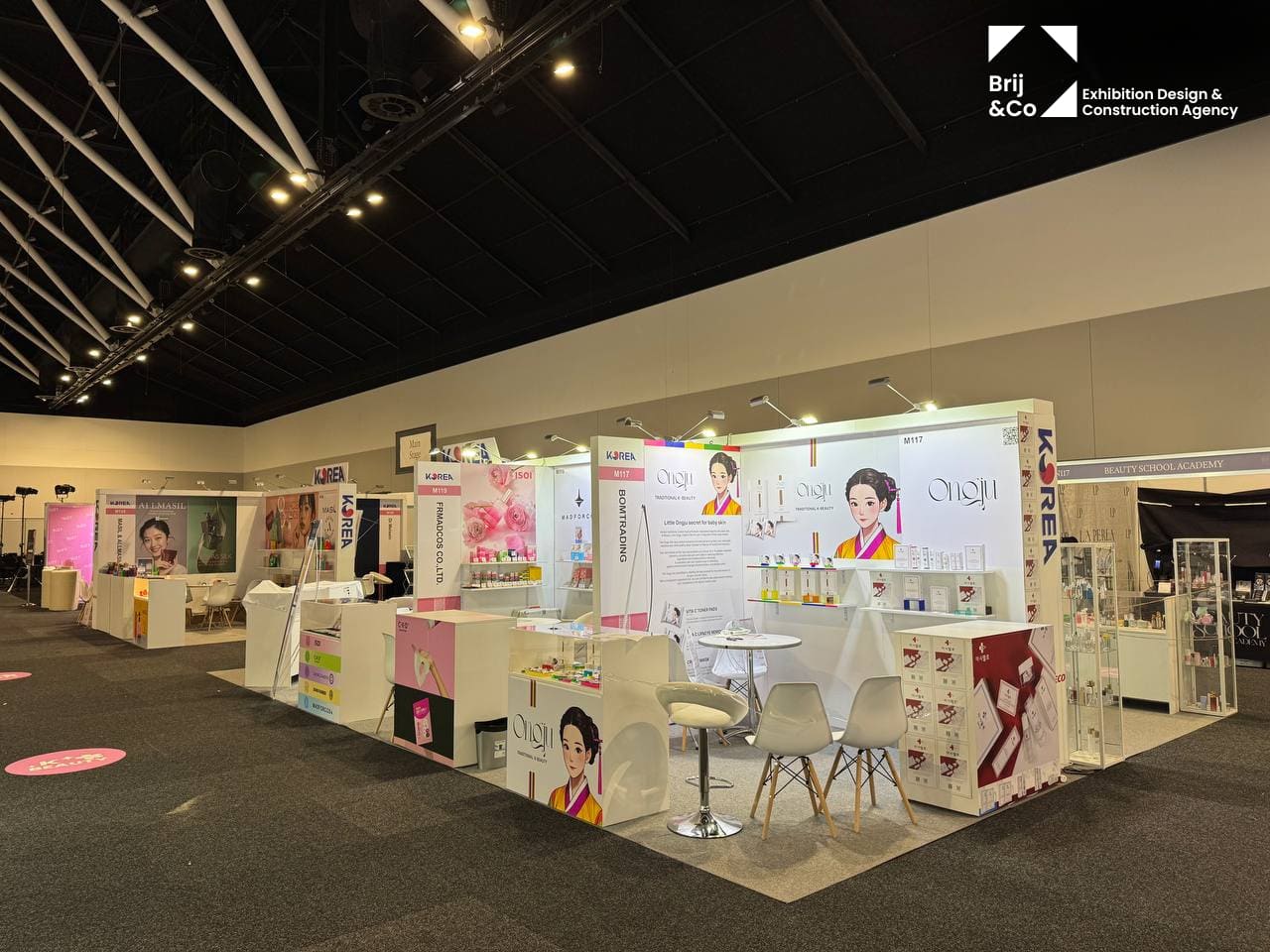 Korea pavilion exhibition stands with pink and white brand graphics