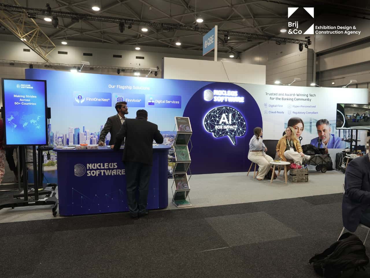 Nucleus Software exhibition stand with a blue backwall and brochure stand