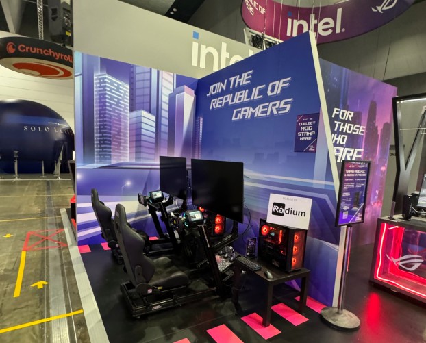 Intel Republic of Gamers racing simulator display at a gaming expo