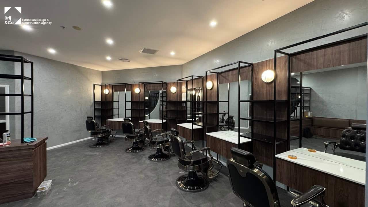 Barbershop fit-out with barber chairs and black steel frames