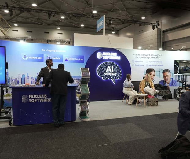Nucleus Software exhibition stand with an AI-themed backwall and meeting area