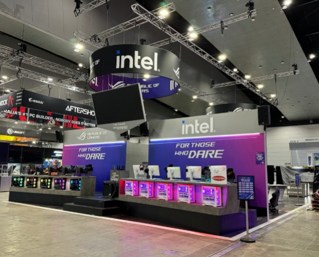 Intel and Republic of Gamers exhibition stand with gaming stations and a hanging circular sign