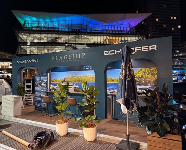 Flagship International outdoor exhibition stand with timber decking and planters