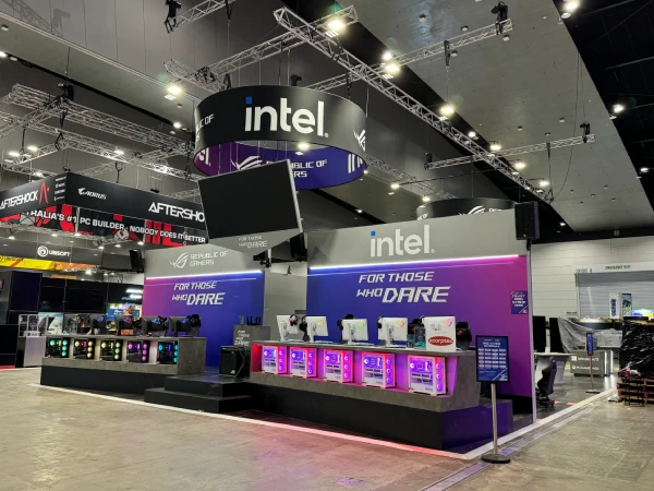 Intel and ASUS exhibition stand with purple-lit gaming counters