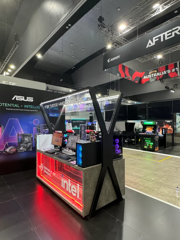 ASUS exhibition stand with a red Intel counter and gaming displays
