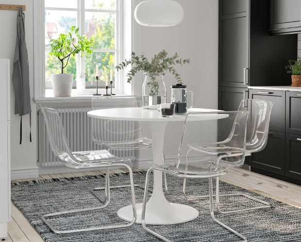Hire furniture: white round table with clear acrylic chairs