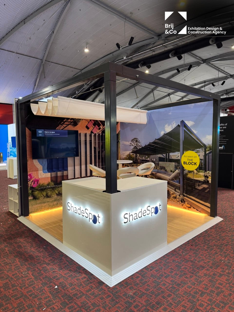 ShadeSpot outdoor shade structure display with a lit counter