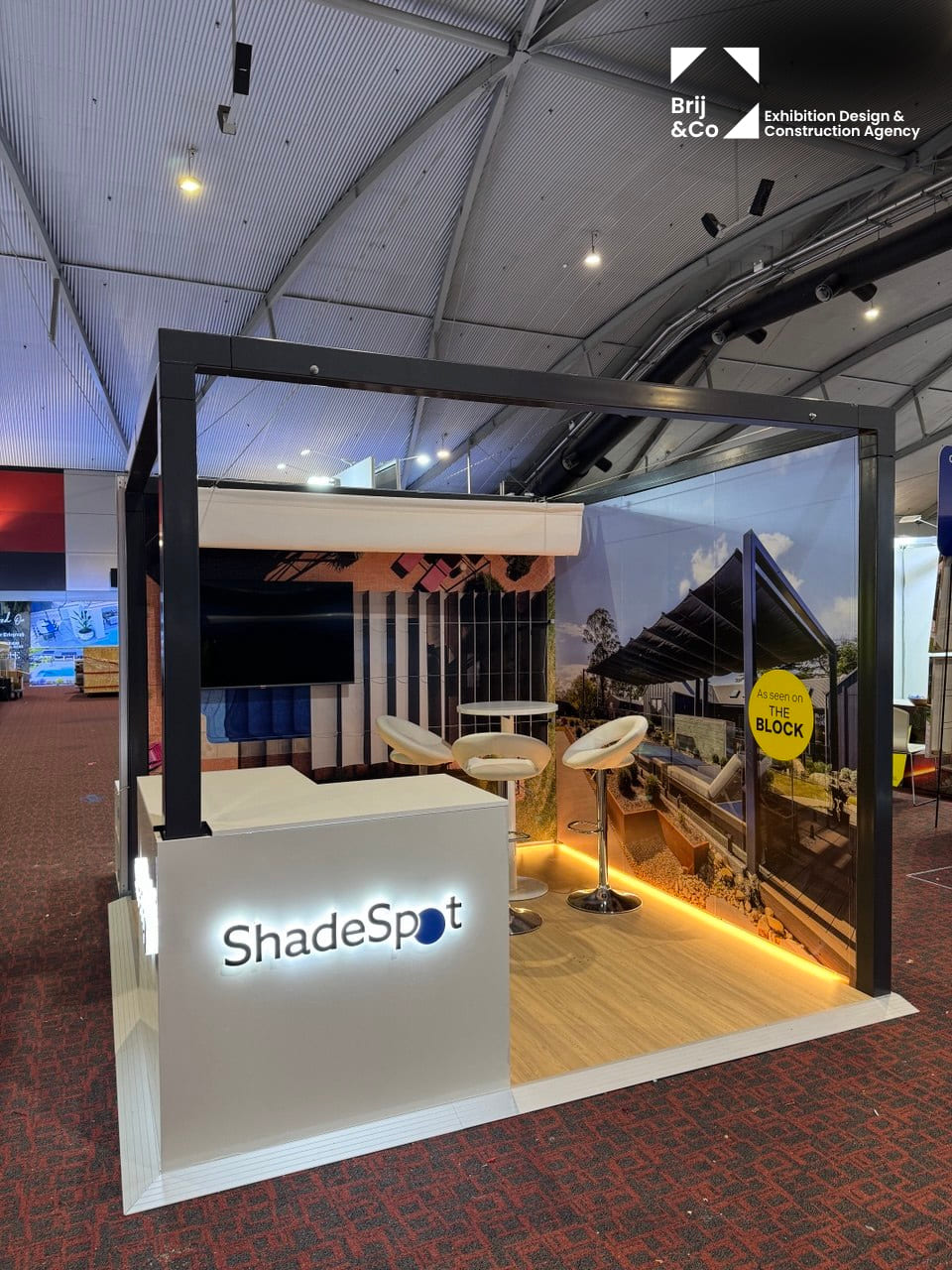 ShadeSpot exhibition stand with a black shade frame and lit counter
