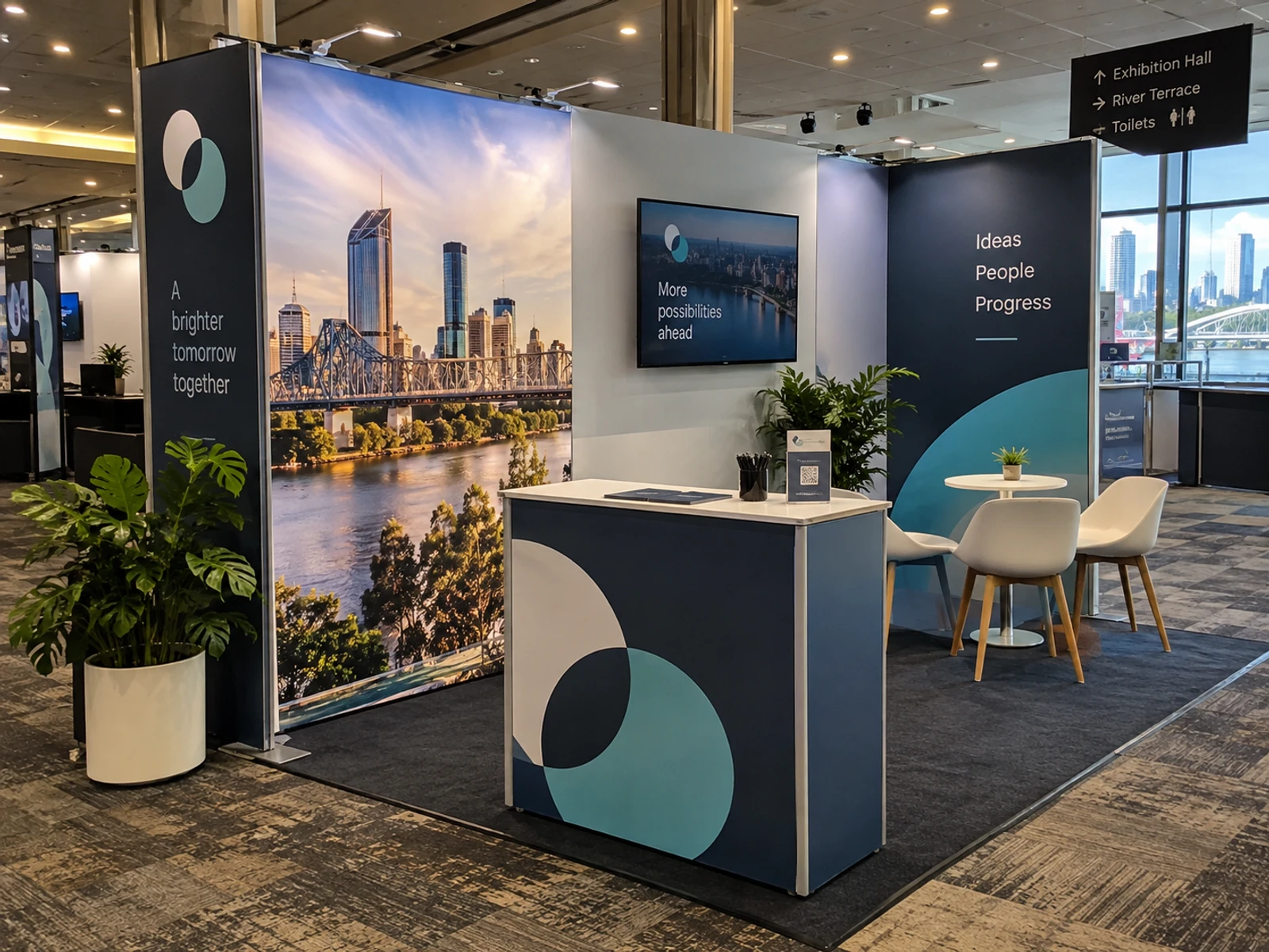 Modular exhibition stand with printed fabric panels and a counter at a Brisbane event