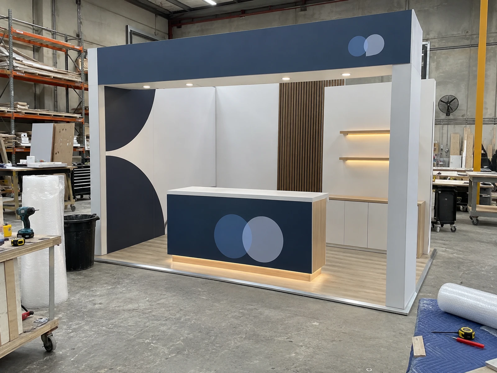 Custom exhibition stand walls and counter pre-assembled in the Brij & Co workshop