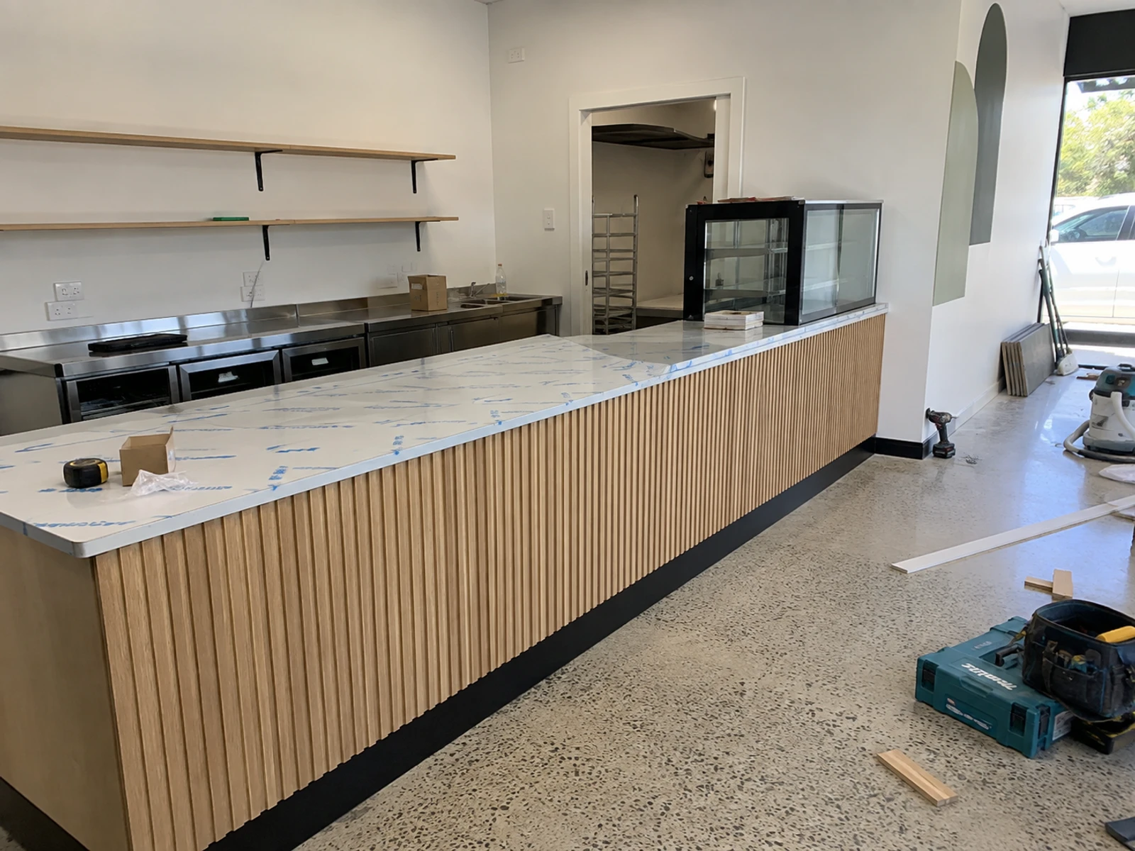 New shop counter installed on site with protective film still on the top